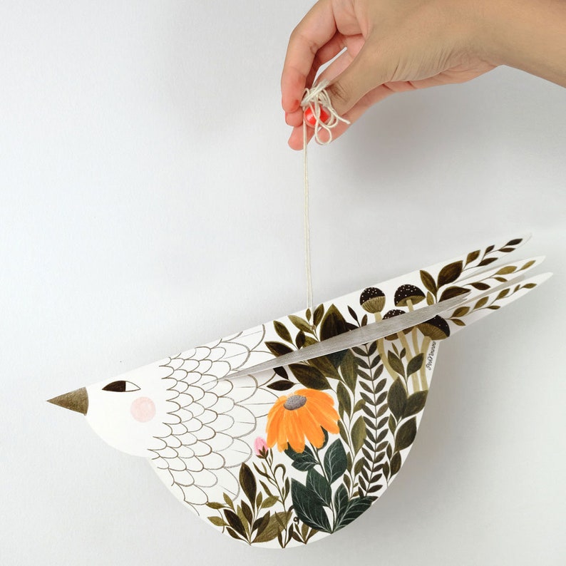 Illustrated hand cut paper bird with plants and floral motifs in green & orange, a beautiful paper sculpture for Valentine's day gift