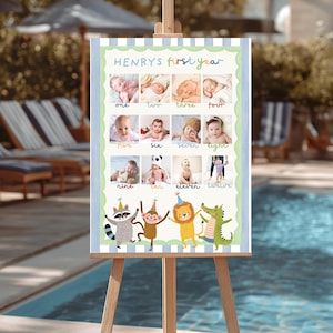 May include: A framed poster on an easel displays a baby's first year milestones. The poster features twelve photos, one for each month, with the text "HENRYS first year" at the top. Colorful cartoon animals decorate the bottom.