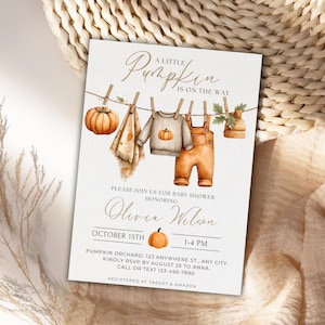 May include: A baby shower invitation with a watercolor design. The invitation features the text "A Little Pumpkin is on the Way." The design includes illustrations of a pumpkin, baby clothes, and a hat hanging on a clothesline. The invitation is for Olivia Wilson's baby shower on October 15th.