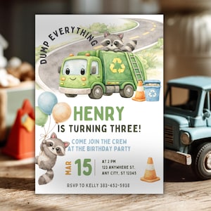 May include: A birthday party invitation featuring a green garbage truck with a raccoon on top. The invitation reads "Dump Everything" and "Henry is Turning Three!" with the date March 15th. Includes balloons, a trash can, and a traffic cone.