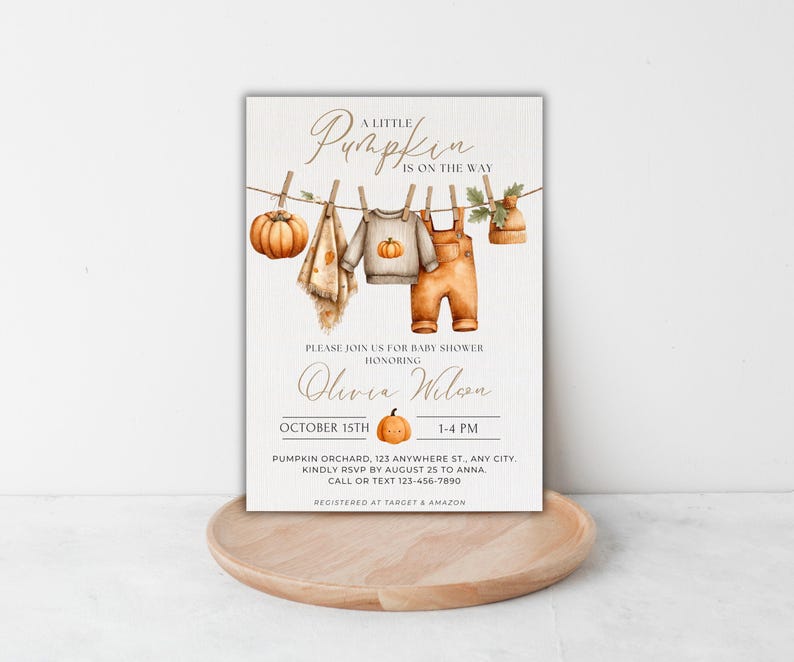 May include: Baby shower invitation with a watercolor design. The invitation features a pumpkin, baby clothes, and the text "A Little Pumpkin is on the Way." The invitation is for Olivia Wilson's baby shower on October 15th.