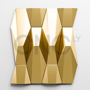 May include: A geometric wall panel with a gold metallic finish. The panel is composed of multiple angular, three-dimensional shapes arranged in a repeating pattern. The design has a modern, abstract aesthetic, with a glossy surface reflecting light.