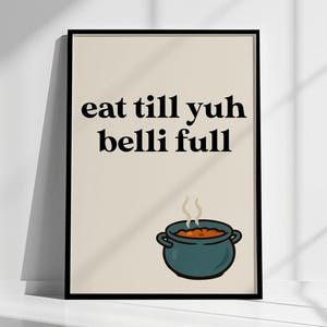 May include: A framed art print with the text "eat till yuh belli full" in black. Below the text is a teal pot with a stew inside, and steam rising from it. The background is a light beige colour.