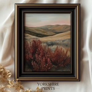 May include: A framed painting of a landscape with rolling hills and a field of red brush. The painting is in a black frame with a gold trim. The text "YORKSHIRE PRINTS" is below the frame.