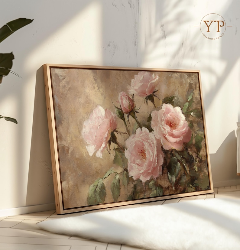 May include: A framed painting of pink roses with green leaves on a beige background. The roses are in various stages of bloom, with some fully open and others still in bud.