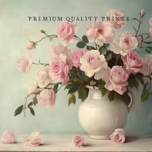 May include: A bouquet of pink roses in a white ceramic pitcher on a light blue background. The roses are arranged in a vase with green leaves. The text "PREMIUM QUALITY PRINTS" is at the top of the image.