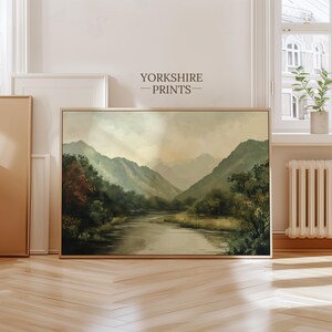 May include: A painting of a landscape with a river flowing through a valley surrounded by green mountains. The sky is a light blue with some clouds.