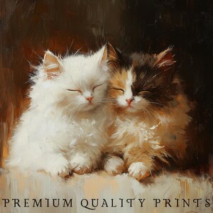 May include: Two adorable kittens, one white and one calico, are curled up together sleeping on a soft, light brown surface. The kittens have their eyes closed and their paws tucked under their bodies. The background is a dark brown color.