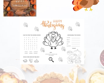 May include: Thanksgiving-themed image with a cartoon turkey and a placemat featuring puzzles and the words "Happy Thanksgiving." The placemat includes a word search, unscramble words, and an I Spy game.