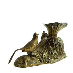 Soporte para velas años 50. Escultura candelabro de bronce con pájaro Roberto Parise. VS21