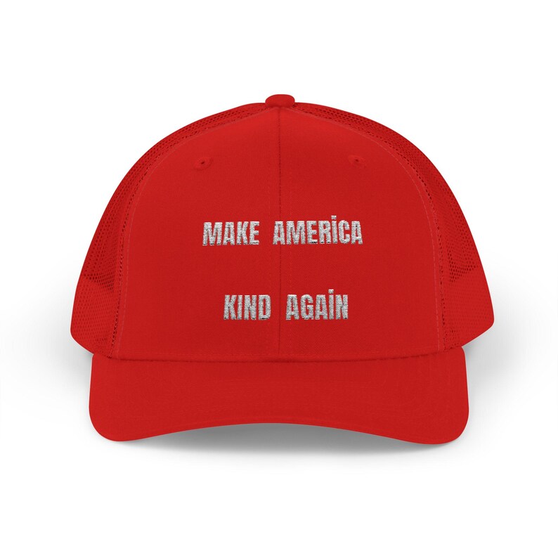 May include: Red mesh trucker hat with white embroidered text that reads "Make America Kind Again".