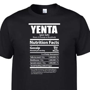 May include: Black t-shirt with white text. The text reads "YENTA" above "Nutrition Facts" with a humorous breakdown of gossip. The shirt lists "Talks too much," "Meddlesome," and "Spreads rumours" as ingredients.