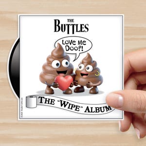 May include: A square sticker featuring a cartoon image of two smiling poop emojis. One holds a red heart, and the other wears a gold earring. Text includes "THE BUTTLES," "Love Me Doo?!," and "THE 'WIPE' ALBUM."