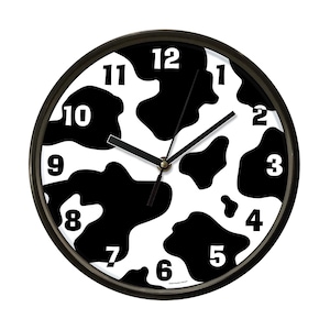 May include: A round wall clock with a black frame and a cow print design. The clock face features black spots on a white background, with black hands and white numerals. The clock measures approximately 10 inches in diameter.
