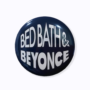 May include: A blue round button with white text that reads "Bed Bath & Beyond".