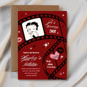 May include: A red birthday invitation featuring a Betty Boop illustration, film strip design, and the text "She's turning 30!". The invitation includes details for Hayley's birthday, with a brown envelope in the background.