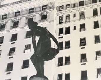 Cachet Matte Fiber based print of silhouette against deco building in New York