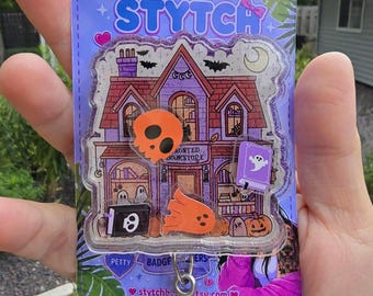 Halloween Haunted Bookstore shaker badge reel (alligator clip)