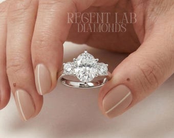 Elongated Oval Cut Lab Grown Diamond Three Stone 10k White Gold Trellis Setting Sustainable Bridal Jewelry Bespoke Anniversary Promise Ring