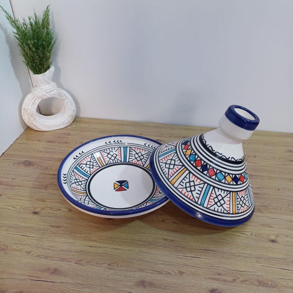 A hand-painted Berber-design ceramic tagine that's as much sculptural art as it is cookware — genuinely one-of-a-kind Moroccan craft.
