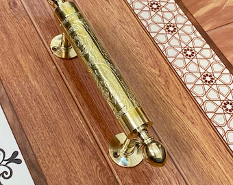 Traditional handmade brass door handle, engraved Moroccan motifs, antique and luxury design for decoration.