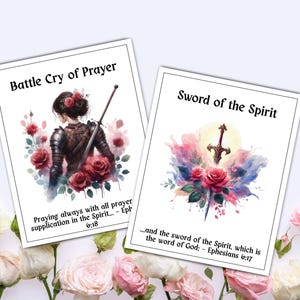 May include: Two watercolor art prints. One features a woman with a sword, roses, and the text "Battle Cry of Prayer." The other shows a sword, roses, and the text "Sword of the Spirit." Both prints have inspirational quotes.