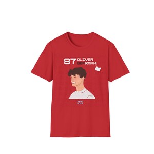 May include: Red t-shirt with a white graphic of a person's head and the text "87 OLIVER BEERMAN".