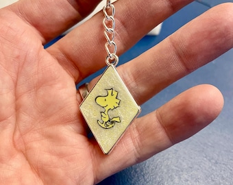 Llavero de resina con el pájaro amarillo de Woodstock, personaje de Peanuts, Snoopy, mejor amigo