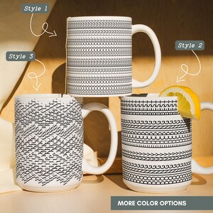 May include: Three white ceramic mugs with black geometric patterns. One mug has a lemon slice. The mugs have different designs, including lines, dots, and shapes. The text "Style 1", "Style 2", and "Style 3" are visible. The text "MORE COLOR OPTIONS" is also visible.