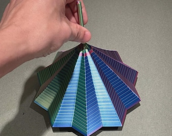 Juguete sensorial antiestrés con forma de estrella y asa