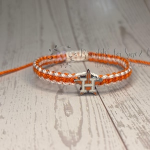 May include: A set of three ceramic mugs with a speckled, matte finish. The mugs are in shades of cream, light gray, and dark gray. Each mug has a simple, minimalist design, perfect for coffee or tea.