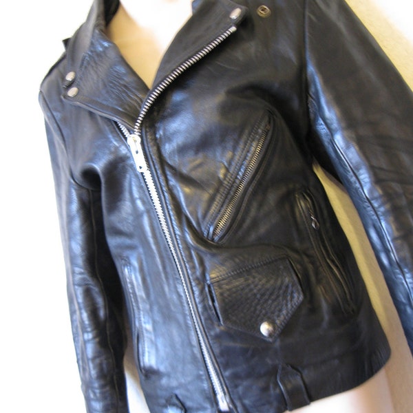 1970's women's leather biker jacket. heavy zipper. motorcycle. small.