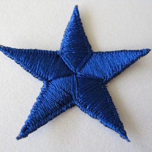May include: A blue embroidered star patch. The star is five-pointed and has a satin finish.