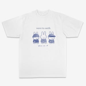 May include: White t-shirt featuring a blue illustration of three rabbit characters, each wearing a different hat. The text "wave to earth" is above the characters, with "flowers and all" below.