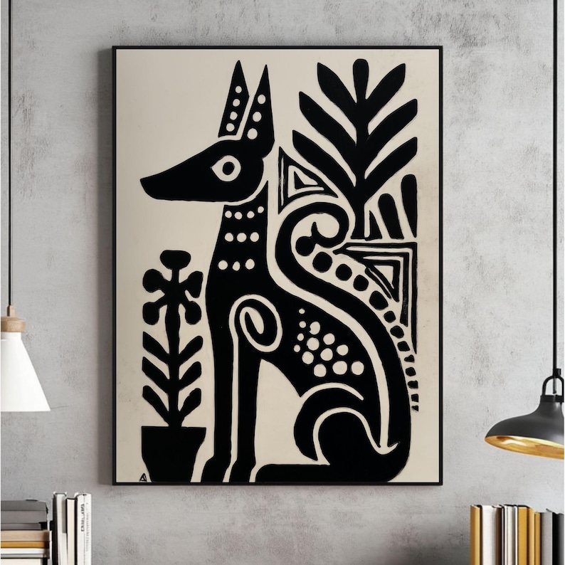May include: Black and white art print featuring a stylized dog with decorative patterns and plant motifs. The artwork is framed in a black border, creating a striking contrast against the neutral background. The dog is depicted in a seated position.