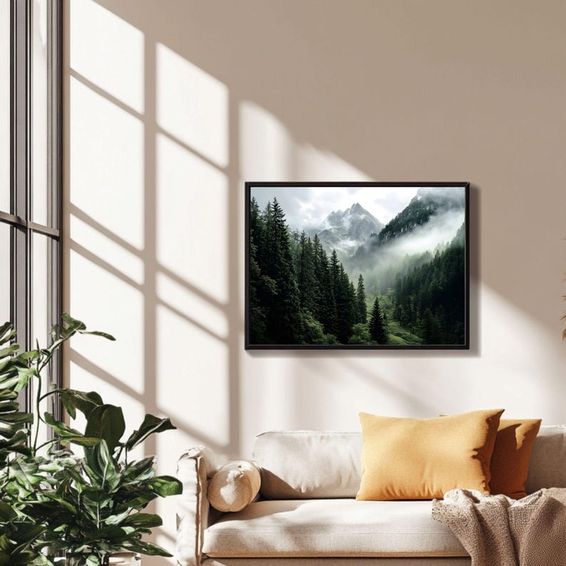 May include: A photograph of a mountain range with a thick layer of fog covering the peaks. The mountains are covered in lush green trees.