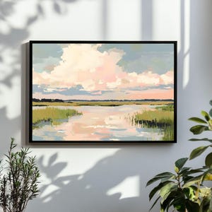 May include: A framed abstract landscape painting featuring a pink and blue sky, green grass, and a reflective body of water.