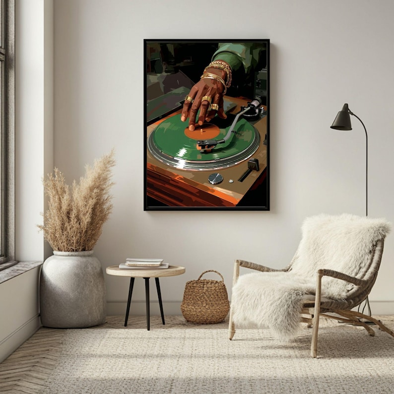 May include: A framed art print featuring a DJ's hand adorned with gold jewelry, manipulating a green vinyl record on a turntable. The artwork has a retro aesthetic, with a brown and green color palette.