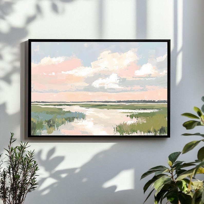 May include: A framed abstract painting of a landscape with a pink and blue sky, white clouds, and a green marsh with a river winding through it.