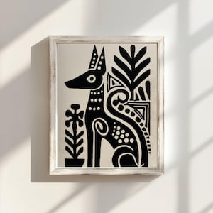 May include: Black and white framed art print featuring a stylized dog illustration. The dog is depicted in a seated position with decorative floral and geometric elements. The artwork is framed in a white, distressed-look wooden frame.