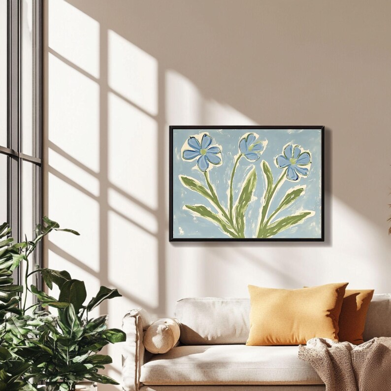 Puede incluir: Una pintura enmarcada de tres flores azules con tallos y hojas verdes sobre un fondo azul claro.