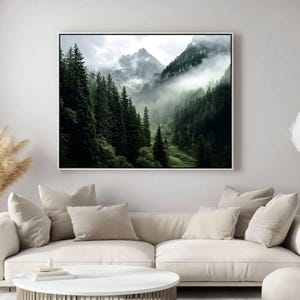 May include: A misty mountain landscape with a dense forest of evergreen trees. The fog creates a sense of mystery and depth in the image.