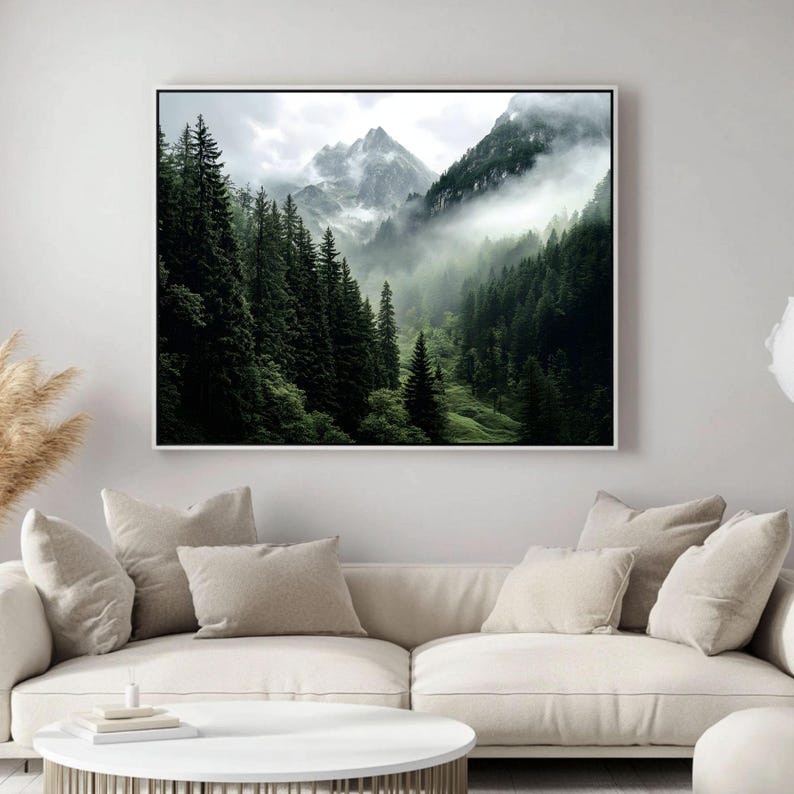May include: A misty mountain landscape with a dense forest of evergreen trees. The fog creates a sense of mystery and depth in the image.