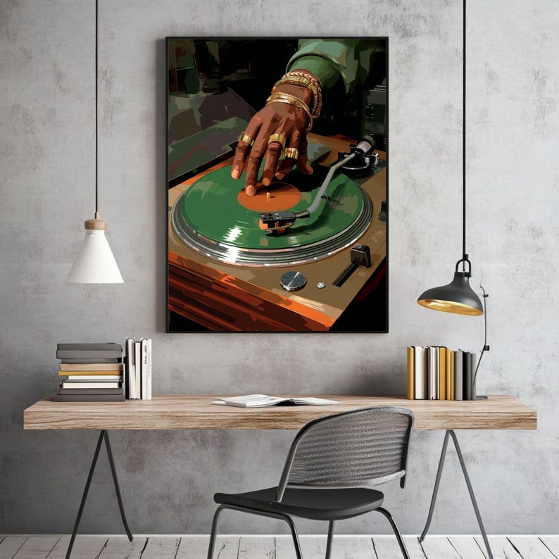 May include: A framed print of a DJ's hand on a turntable. The turntable has a green record with an orange center. The DJ's hand is adorned with gold rings and bracelets. The artwork has a modern, graphic style.