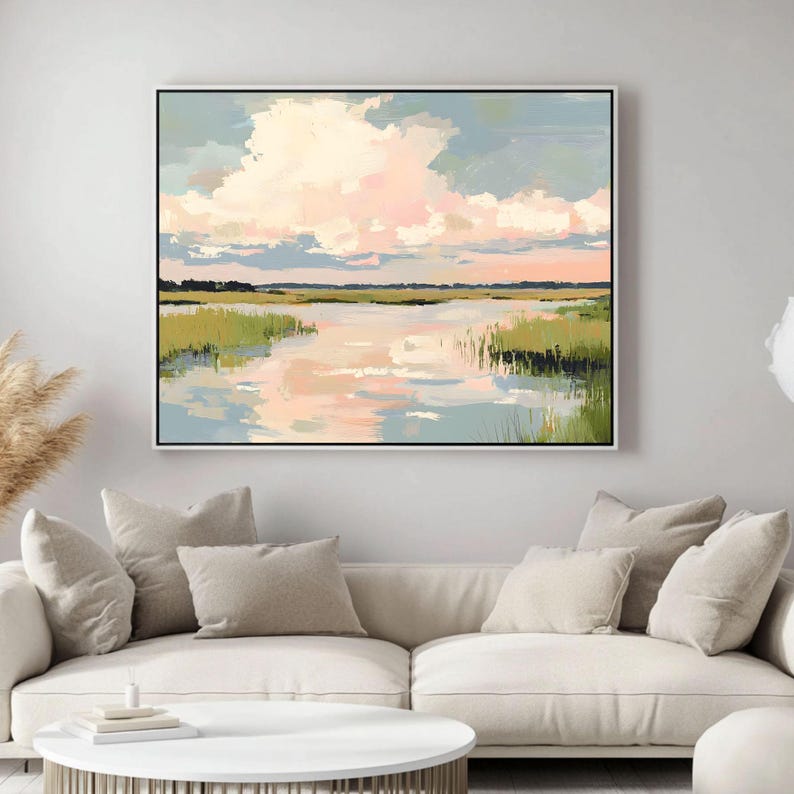 May include: A painting depicting a landscape with a lake, green grass, and a pink and blue sky with clouds. The lake reflects the sky and clouds.