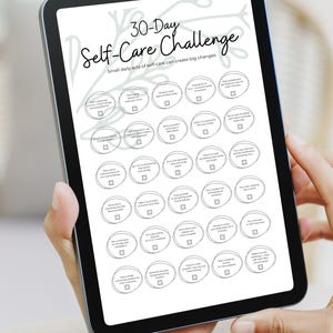 May include: A digital tablet showing a 30-Day Self-Care Challenge. The screen displays a list of self-care activities in a circular format. The text "30-Day Self-Care Challenge" is at the top, with the tagline "Small daily acts of self-care can create big changes."