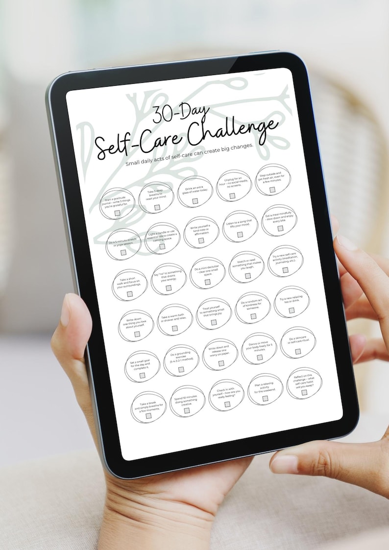 May include: A digital tablet showing a 30-Day Self-Care Challenge. The screen displays a list of self-care activities in a circular format. The text "30-Day Self-Care Challenge" is at the top, with the tagline "Small daily acts of self-care can create big changes."