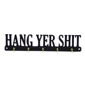 May include: Black key holder with the text "HANG YER SHIT" and five gold hooks.