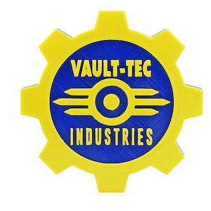 May include: A yellow and blue Vault-Tec Industries logo. The logo is circular with a yellow cogwheel border. The center features a blue circle with the words "VAULT-TEC INDUSTRIES" and a stylized emblem.