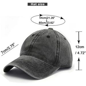 May include: A gray baseball cap with a curved brim. The hat's crown measures 12cm/4.72" high, with a circumference of 54cm/21.26" to 60cm/23.62". The brim is 7cm/2.75" long. The hat is labeled "Hat size".